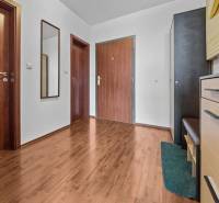 Entrance hall in a 2-room apartment with wardrobes and a wall-mounted coat rack.