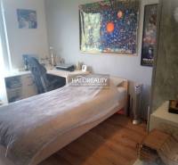 Children's room with a desk, bed, and decorations in a 3-room apartment.