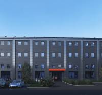 A building with a parking lot in front of warehouses and halls on Južná trieda in Košice - Juh district.