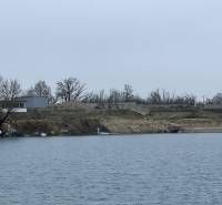 Construction activity by the water in Rovinka at Lake Veľké Košariská, recreational plots.