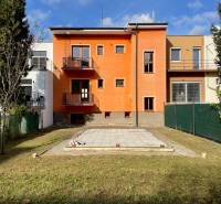 A family house on Hurbanova Street in Trenčín with a colorful facade and a landscaped garden.