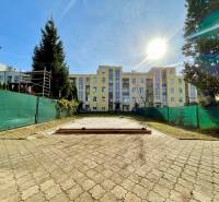 Paving and fence in front of the apartment building on Hurbanova Street in Trenčín.
