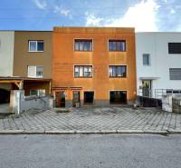 A family house on Hurbanova Street in Trenčín, with an orange facade and parking.