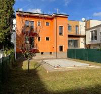 A family house on Hurbanova Street in Trenčín with an orange facade and a garden.