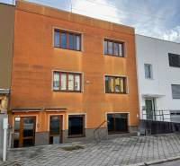 A family house on Hurbanova Street in Trenčín with an orange facade and large windows.