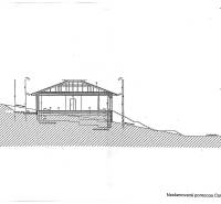 Architectural section through the building from the project documentation Land - housing.
