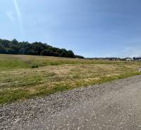 The landscape in Gregorovce is ideal for residential plots, surrounded by meadows and houses.