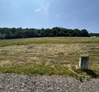 Beautiful natural scenery in Gregorovce, residential plots surrounded by greenery and blue skies.