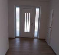 A hallway with doors and a wooden floor, Family house on Adyho Street.