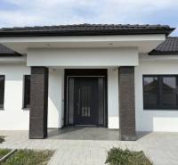 A family house on Adyho Street in Dunajská Streda with an entrance terrace and a dark portal.