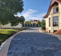 A family house on Dolnočermánska in Nitra with a paved walkway and greenery.