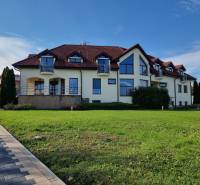 A family house on Dolnočermánska Street in Nitra with a landscaped lawn and terrace.