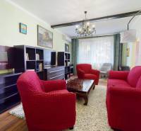 Living room in a 3-room apartment with comfortable furniture and decorations.
