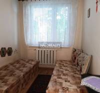 A room with two beds and a radiator in a 3-room apartment.