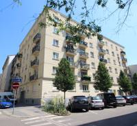 Apartment building on Medená Street in Bratislava - Old Town with a parking lot in front of the building.