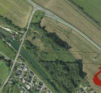 Aerial view of properties - housing in the village of Podtureň near the road and river.