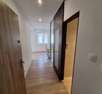 Entrance hall of a 4-room apartment with a bright interior and wooden flooring.