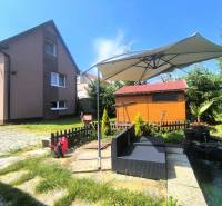 A family house in Nitrica with a garden seating area and a gazebo.