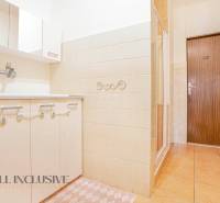 Bathroom with a sink and a shower in a family house.