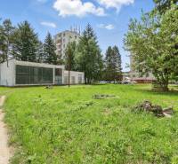 Plots - housing on Slnečná Street in Kováčová surrounded by greenery and buildings.