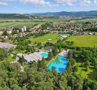View of the swimming pool and surroundings in the Kováčová area on Slnečná Street. Plots - residential.
