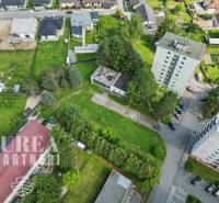 Aerial view of Slnečná Street, Kováčová, type: Residential land with apartment building and houses.