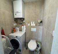 Toilet with washing machine and boiler in a 2-room apartment for rent.