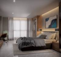 A bright bedroom with a bed and a desk in a 3-room apartment.