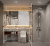 A modern bathroom with a shower and an illuminated mirror in a 3-room apartment.
