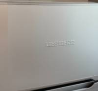 Liebherr refrigerator with a silver finish in a 2-room apartment.