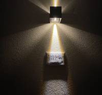 Wall lamp illuminating the inscription 