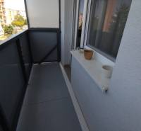The balcony of a 3-room apartment on Jánošíkova Street in Nové Zámky with a view of the neighboring houses.