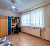 A room in a 3-room apartment with a desk, a wardrobe, and a chair.