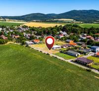 Residential plots in Nižná Kamenica, surrounded by picturesque landscape and hills.