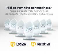 Advertisement for an award-winning real estate agency with glass trophies and RADO group logos.