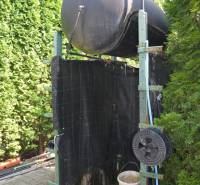 In Trstín, near a family house, we see a water tank with an outdoor shower.