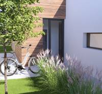 A family house in Gaboltov with a modern garden, a bicycle, and a wooden facade.
