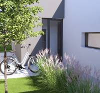 A family house in Gaboltov with a bicycle, a tree, and ornamental grass.