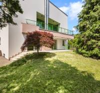 A villa on Čremchová Street in Bratislava - Koliba, with a terrace and greenery in the garden.