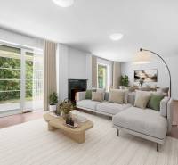 Living room in a villa with a fireplace, sofa, and dining table, overlooking the garden.