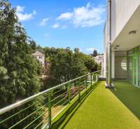 The balcony of the villa on Čremchová Street in Bratislava with a view of greenery and the residential district.