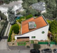 A villa on Čremchová Street in Bratislava - Koliba with a modern roof and garden.