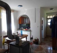 Kitchen with a dining table and stove in a family house.