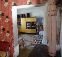Interior of a family house with colorful wallpapers and rustic accessories.