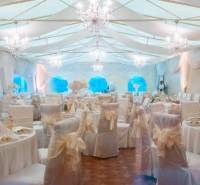 Banquet hall with white decorative elements and floral arrangements, Hotels and guesthouses.
