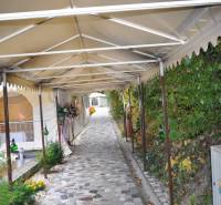 Covered walkway with flowers in the exterior of hotels and guesthouses in Košice - North.