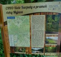 Information board of the White Carpathians Protected Landscape Area and the source of the Myjava River in nature.