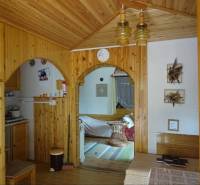 The interior of a family house with interesting arches and a wooden ceiling, cozy environment.