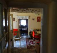 Traditional interior of a family house with a carpet and furniture in warm colors.