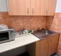 Offices with a kitchenette, microwave, and sink.